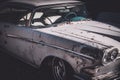 Front side view of a worn and beat up classic American car from the fifties Royalty Free Stock Photo