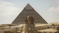 The front of the sphinx and pyramid of khafre at giza near cairo Royalty Free Stock Photo