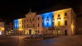 The front of the Stadttheater on the Bismarckplatz in Regensburg illuminated in the Ukrainian national ensign colors blue and