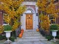 Front steps of house with pumpkins