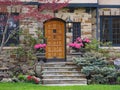 Front steps of stone house with elegant wooden door