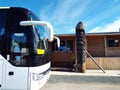 The front of the tourist bus against the backdrop of blue skies and local exoticism Royalty Free Stock Photo