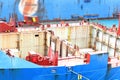 Front of the transport ship on the water, top view. The bow of the ship with an anchor winch, ropes on the deck, mooring bollards Royalty Free Stock Photo