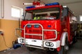 The front of the truck of an old Polish fire truck with visible blue light signals, water cannon and the Polish word `STRAZ`. Royalty Free Stock Photo