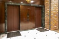 Front of Two close elevators in old retro style Hotel