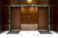 Front of Two close elevators in old retro style Hotel