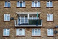 the front of a typical English council flat block with balconies and washing lines Royalty Free Stock Photo
