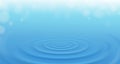 Front up view angle of water ripple from rain drop on blue paddle background Royalty Free Stock Photo