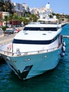 Front view from above of a white yacht moored in the port of Mahon on the island of Menorca