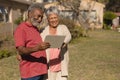 Senior couple using digital tablet in the park Royalty Free Stock Photo