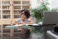 Girl doing her homework on a table at home Royalty Free Stock Photo