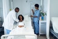 Male doctor examining female patient with stethoscope in the ward Royalty Free Stock Photo