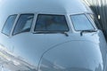 Close up of a jet airplane cockpit Front view of the airplane window with windshield wipers. Royalty Free Stock Photo