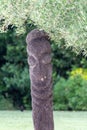 carved wood totem statue as a warning sign