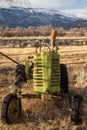 View of antique farm tractors in field in California valley Royalty Free Stock Photo