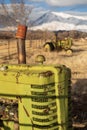 View of antique farm tractors in field in California valley Royalty Free Stock Photo