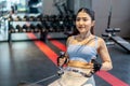 Front view of Asian women doing exercises in fitness, exercises to strengthen muscles and strength, lose body fat burning, Royalty Free Stock Photo