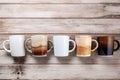 Front view assorted coffee cups on a wooden table background with copy space