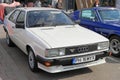 Front view Audi Coupe 1986 white car parked in Retro Electro Parade Ploiesti