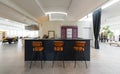Front view with bar counter and three orange leather stools. Elegant interior Royalty Free Stock Photo