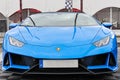 Front view of a beautiful blue Lamborghini Huracan on a sunny day