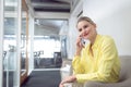 Female executive talking on mobile phone in office Royalty Free Stock Photo