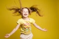 Longhaired girl in cute shirt playing with hair and twirling