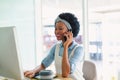 Female graphic designer talking on mobile phone at desk Royalty Free Stock Photo