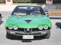 Front view of a beautiful vintage green car model Alfa Romeo Montreal manufactured by Italian Alfa Romeo