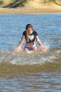 Teen girl splashing in water