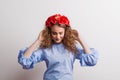 A front view of young beautiful woman with flower headband looking down. Royalty Free Stock Photo