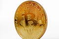 Front view of bitcoin with slightly tilted composition, has a gold colour isolated on white background Royalty Free Stock Photo