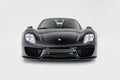 Front view of a black Porsche 918 Spyder on a white background Royalty Free Stock Photo