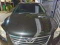 Front view of the black Toyota Camry sedan car