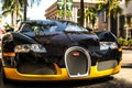 Front view of a Black and yellow Bugatti Veyron