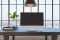 Front view on blank dark monitor screen on wooden table with green plants in glass vase and big window with city view. 3D