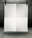 Front view of blank paper poster hanging on rope