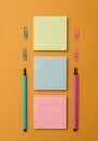 Front view blank sticky note two ballpoints pens clips trendy pastel cool background. Empty text future important events Royalty Free Stock Photo