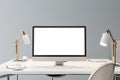 Front view on blank white modern computer monitor with place for your logo or text on white work table with stylish lamps on light