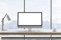 Front view on blank white modern computer monitor screen with space for your logo or text on wooden table with white lamp and Royalty Free Stock Photo