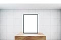 Front view on blank white modern digital tablet screen with space for web design, website or application on wooden stage in empty Royalty Free Stock Photo