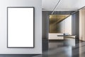 Front view on blank white poster with place for your logo or text on light grey wall in sunlit spacious office on modern dark Royalty Free Stock Photo