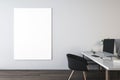 Front view on blank white poster with space for your logo or text on light wall background in stylish office with modern computer Royalty Free Stock Photo