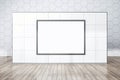 Front view on blank white poster with space for your logo or text on sunlit light squared concrete wall partition on wooden floor Royalty Free Stock Photo