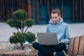 Blonde girl holding laptop, smiling. Royalty Free Stock Photo