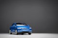 Front view of a blue colored  2017 Brand Tesla Model X 90D on a gray background Royalty Free Stock Photo