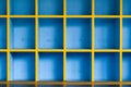Front view of a blue wooden cabinet compartmentalize on cells with empty shelves Royalty Free Stock Photo