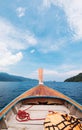 Front view boat floating on blue ocean