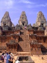 Front view from the bottom of the final squared pyramid which rises in three steep tiers to the central sanctuary at the summit of