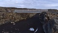 Front view of Bridge Between Continents that connects the Eurasian and American tectonic plates above rock fissure.